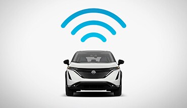 Nissan Ariya 2023, symbole Wi-Fi bleu pour illustrer NissanConnect avec point d’accès Wi-Fi.